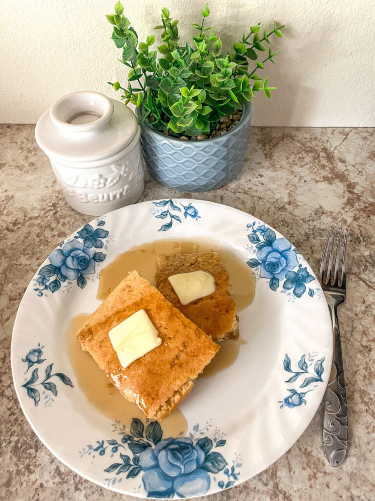 baking sheet pancake served with butter and maple syrup