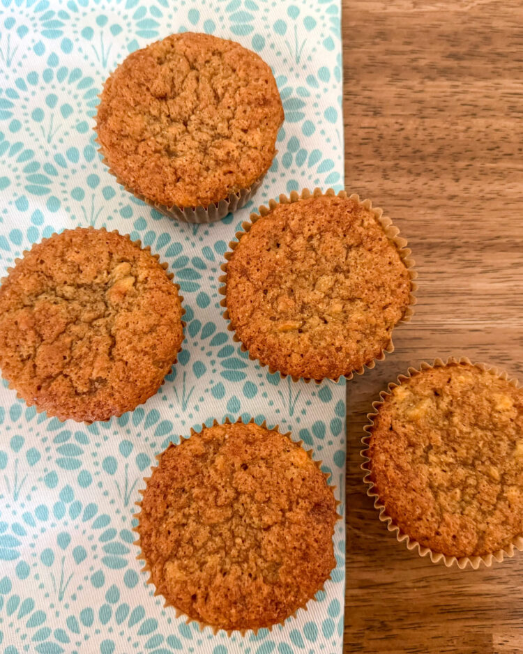 einkorn banana muffins on turquoise patterned placemat